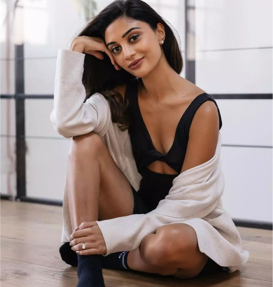 Riya leading a rooftop Pilates session